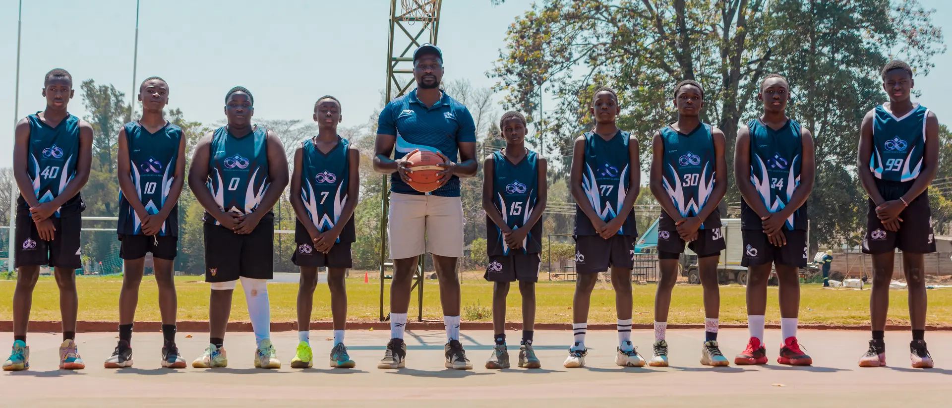 Infinite Sports Academy team lineup on the court