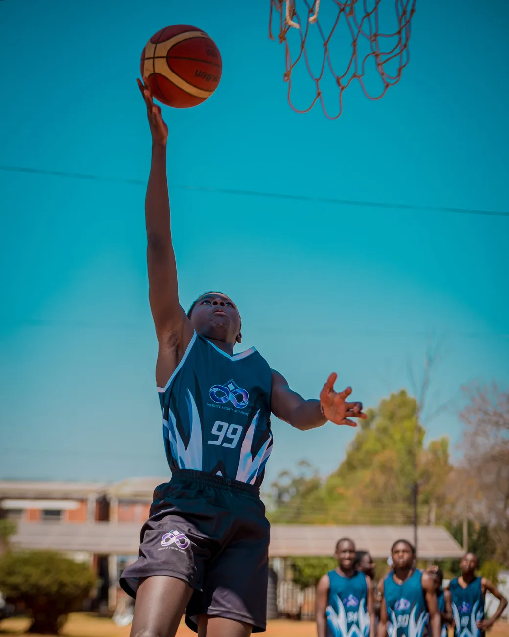 Young athlete performing a layup
